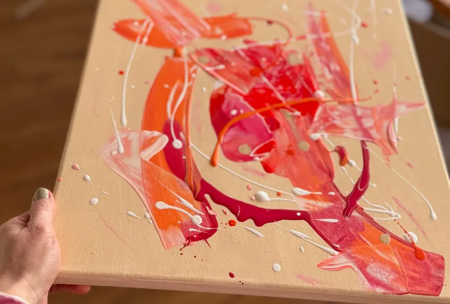 Abstract painting with pink, orange brush strokes.