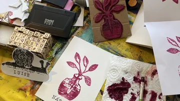 Block print and stamp crafting on table.