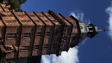 Historic tower against a blue sky.