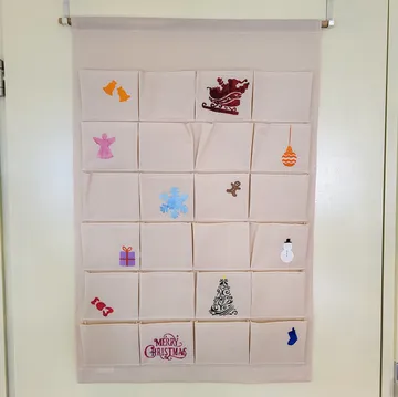 Fabric advent calendar with Christmas motifs.