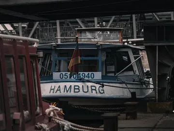 Boat in the port of Hamburg, leashed and ready.
