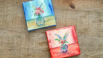 Two painted canvases with flower vases.