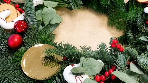 Festive wreath with ornaments in circular arrangement.
