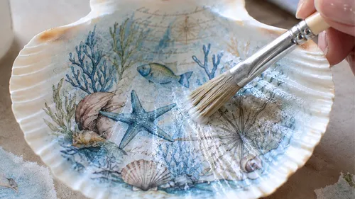 Hand painting seashell with ocean design.