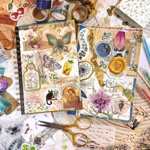 Scrapbook decorated with colorful stickers, tapes, scissors.