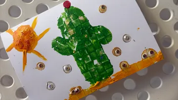 Painted cactus and sun on white card