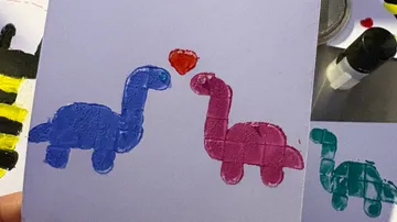 Colorful dinosaur art on a greeting card