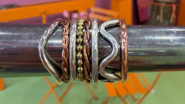 Metal rings resting on a metal rod.