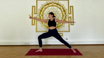 Woman doing yoga pose holding a wine glass.