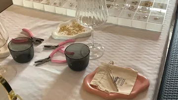 Jewelry crafting tools and materials on table.