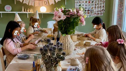 Kids crafting clay at birthday party.