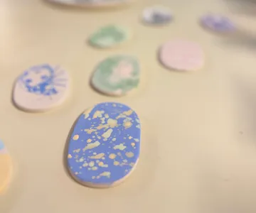 Painted stones on a smooth surface.