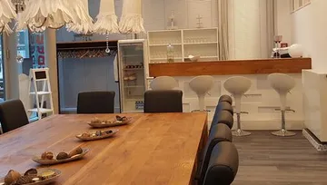 Dining table with chairs in a modern room.