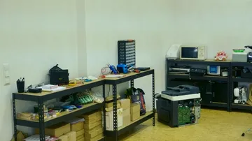 Workshop with shelves and electronics