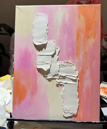 Textured painting on pink-orange canvas.