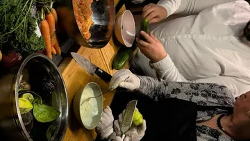 People preparing food in a kitchen.