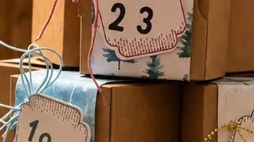 Stacked boxes with decorative numbers attached.