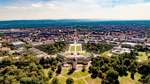 Aerial view of a large palace in a city.