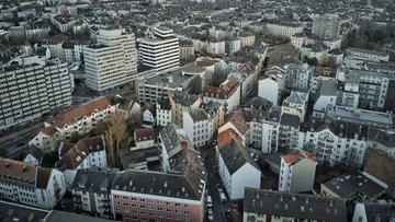 Aerial view of city with dense buildings.