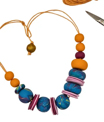 Colorful beaded necklace with scissors.