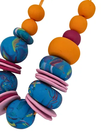 Colorful beads connected on a string.