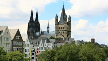 Cathedral and church towers against cloudy sky.