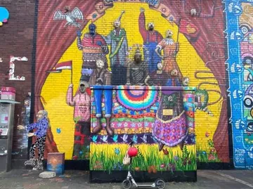 Colorful mural on urban building wall.
