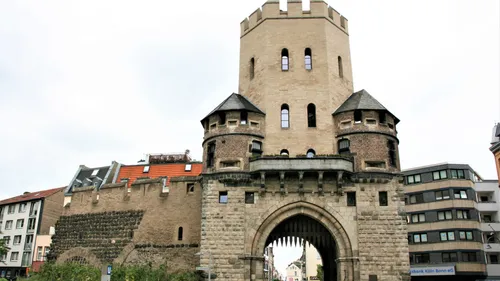 Historic city gate in urban setting.