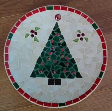 Mosaic tree decor on wooden floor.