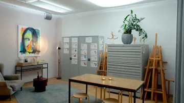 Art studio with painting and easels.