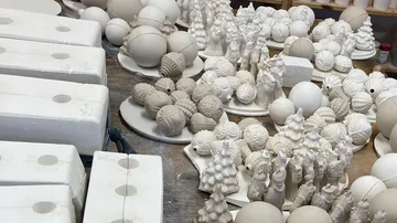 Ceramic molds on a workshop table.