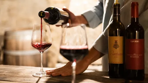 Red wine being poured into glass