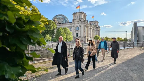 People walking near the Reichstag building.