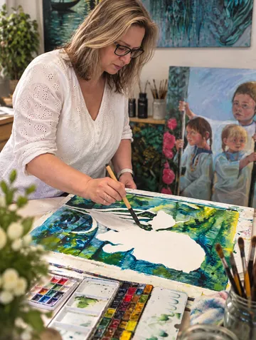 Woman painting in art studio.
