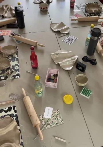 Ceramic tools on table during pottery class.