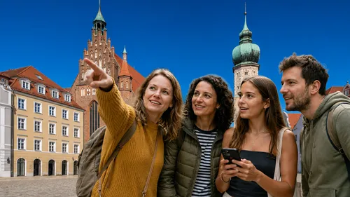 Group of four people sightseeing in city square.