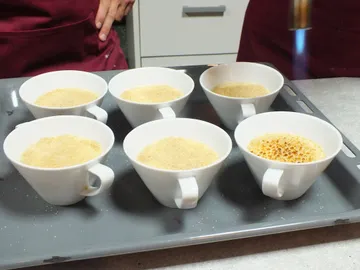 Bowls with sugar are caramelized with flame.