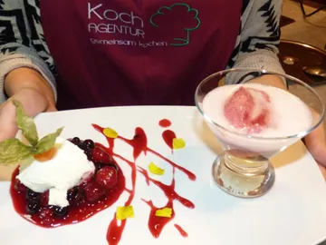 Dessert platter with fresh berries and cream, served.