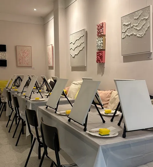 Empty canvases on easels in art studio.