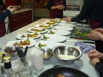 Paved plates are prepared in a cooking environment.
