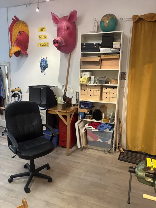 Office chair in room with art decorations.