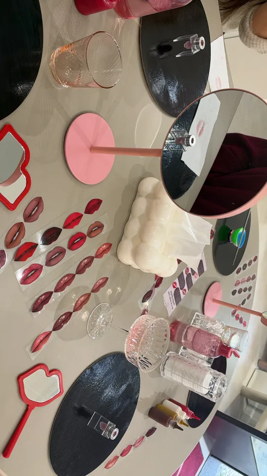 Table with makeup and mirrors arranged neatly.