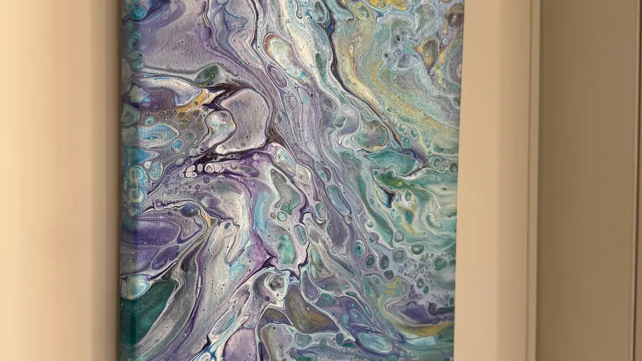 Abstract painting with swirling colors on canvas.
