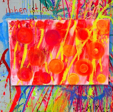 Colorful abstract painting with circles and splashes.