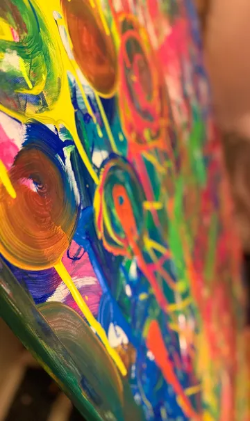 Abstract painting with vibrant swirling colors.