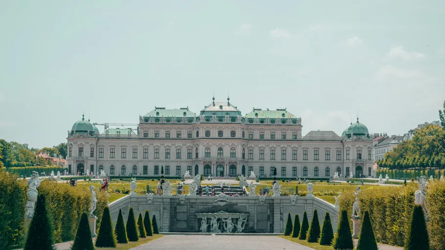 Palace with gardens and statues in front