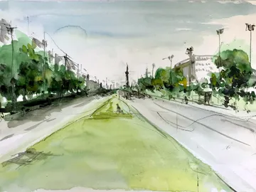 Green field, road traffic, urban landscape under cloudy sky.