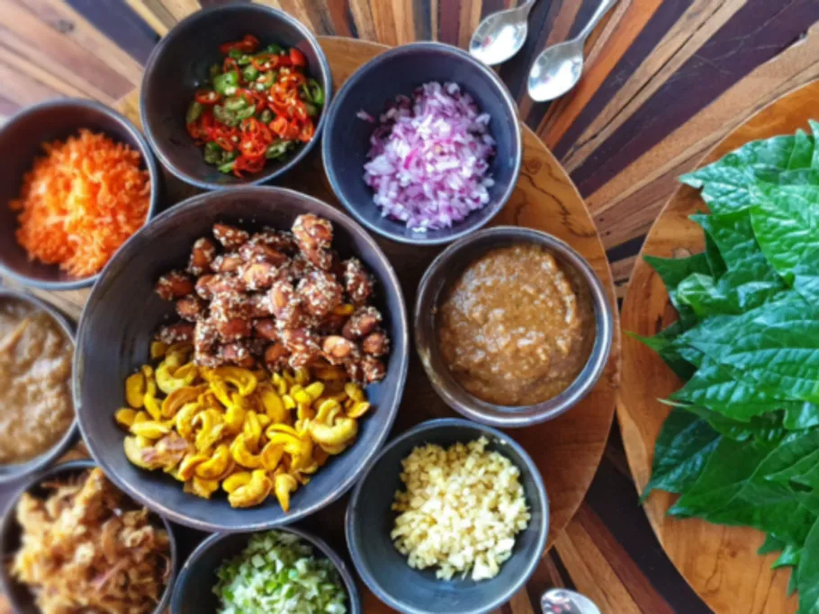Colourful bowls with ingredients for a meal on a table.