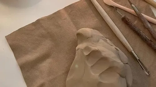 Clay with tools on a table.