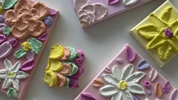 Colorful textured flowers on canvas panels.